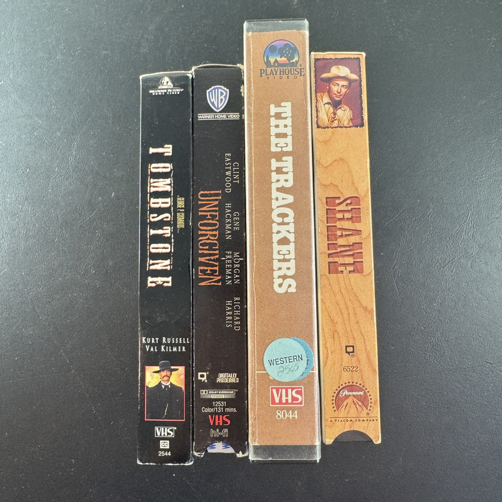 Set of 4 vintage Western VHS tapes including Tombstone, Unforgiven, Shane, and The Trackers