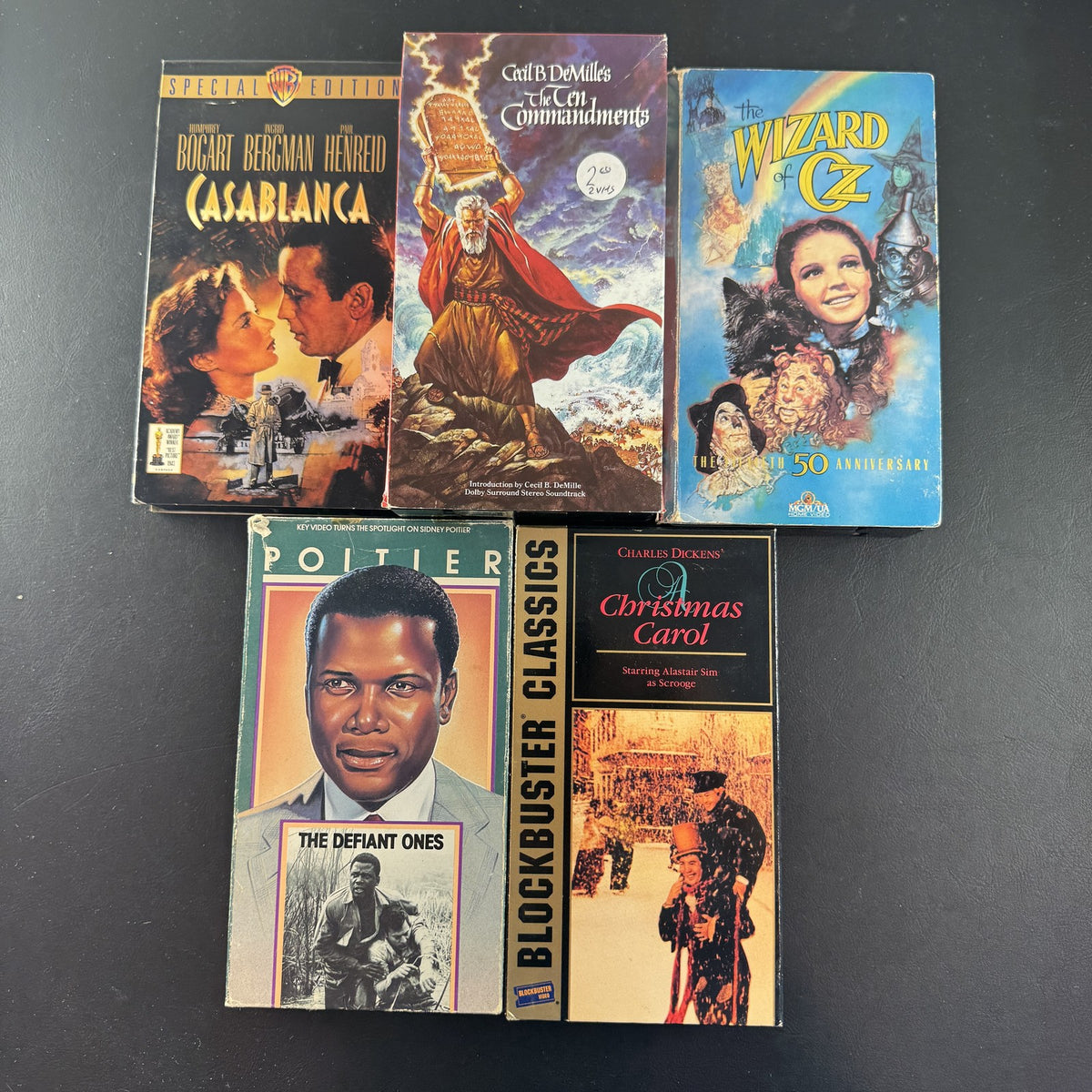 Set of 5 vintage Golden Age Hollywood movie VHS tapes including Casablanca, The Wizard of Oz, and The Ten Commandments.