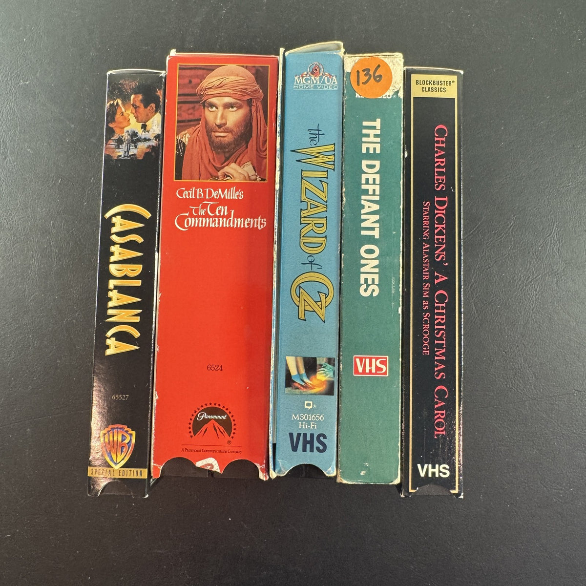 Set of 5 vintage Golden Age Hollywood movie VHS tapes including Casablanca, The Wizard of Oz, and The Ten Commandments.