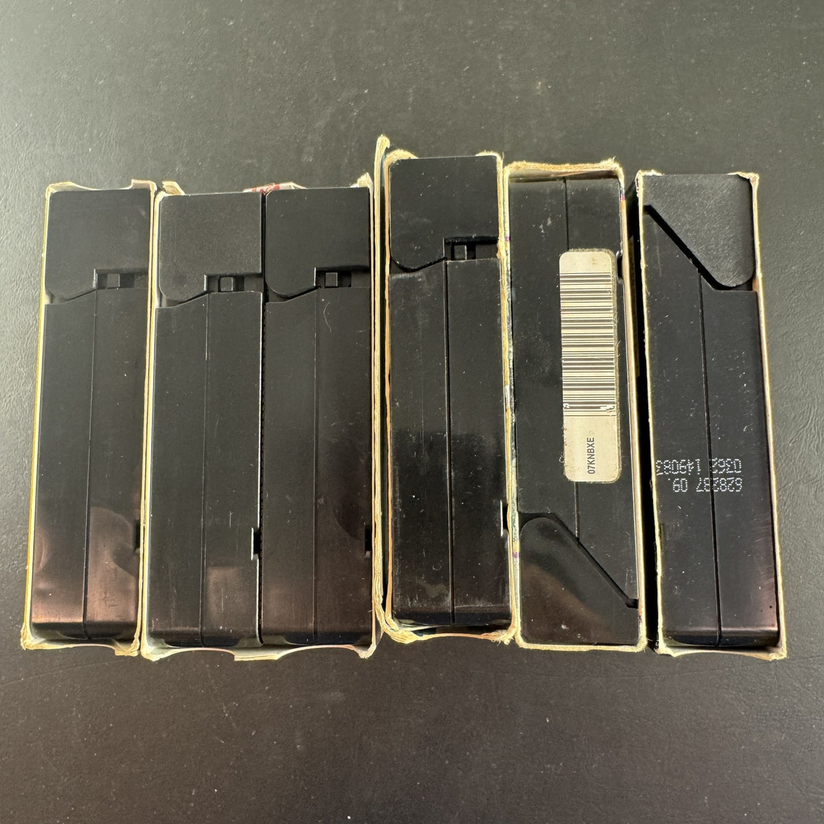 Set of 5 vintage Golden Age Hollywood movie VHS tapes including Casablanca, The Wizard of Oz, and The Ten Commandments.