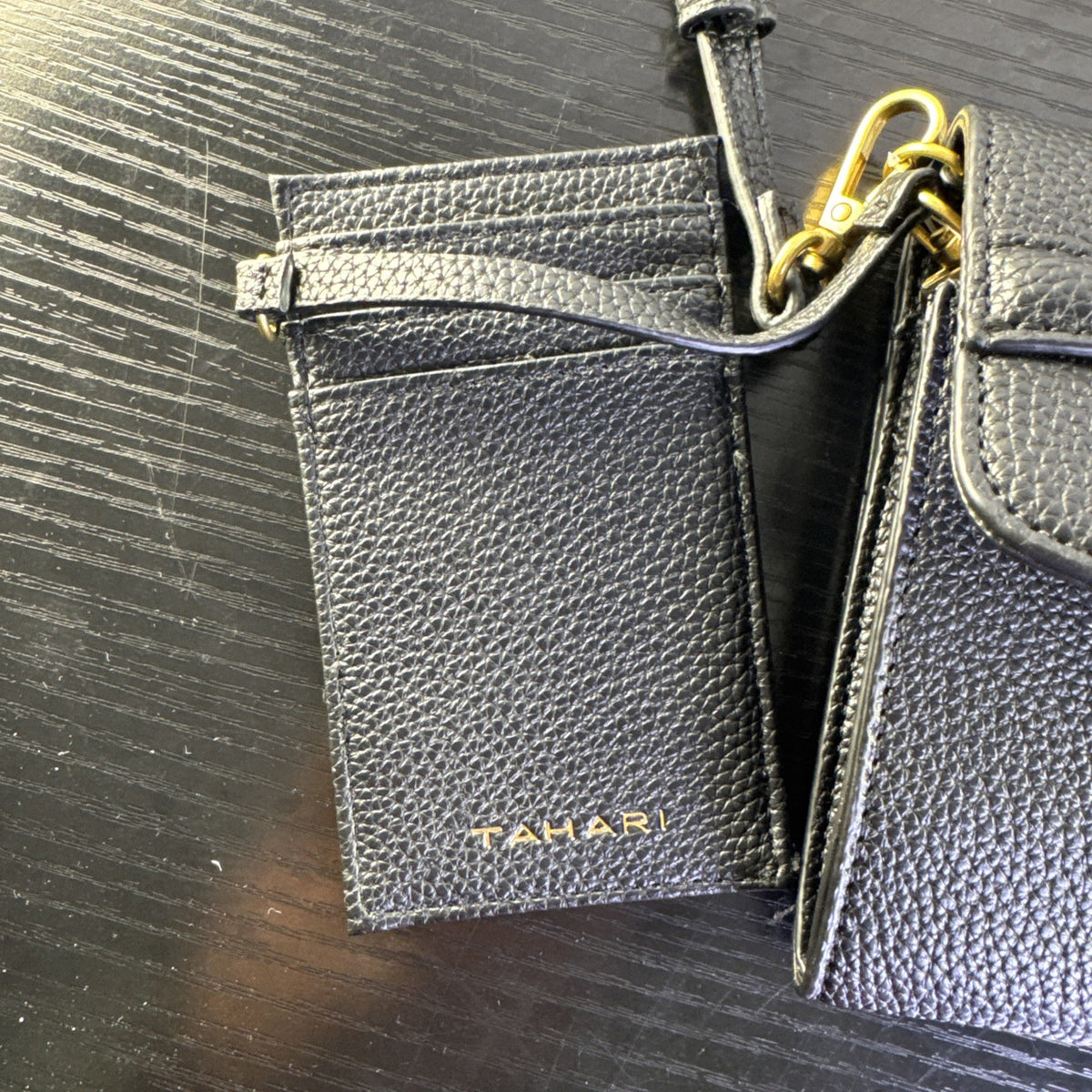 Tahari black pebbled faux leather crossbody bag with goldtone chain accent and magnetic flap closure