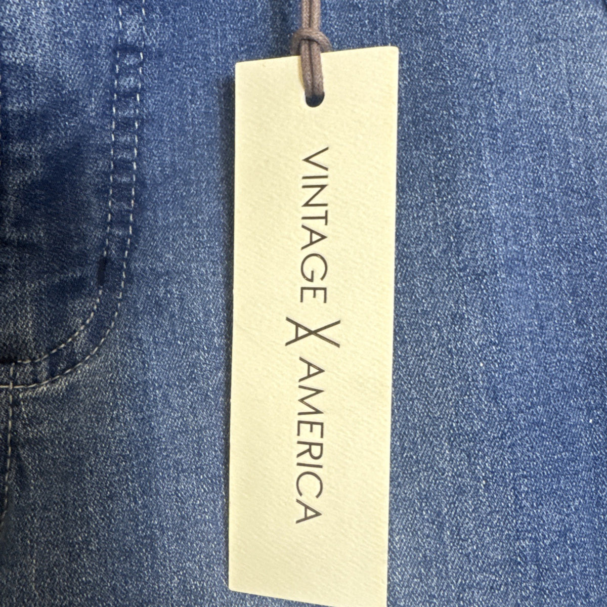 Vintage America women's medium wash stretch denim cargo bootcut jeans in size 4, new with tags.