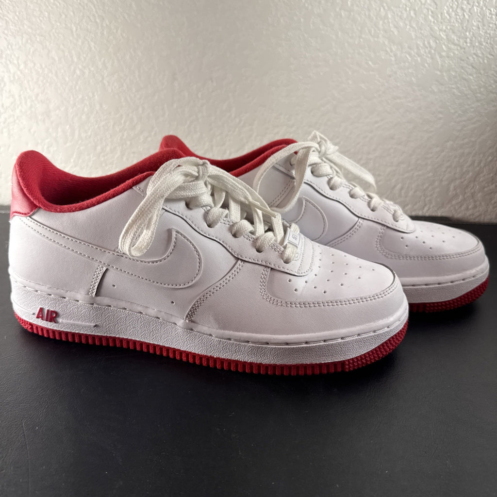 Nike Air Force 1 Low sneakers in White and University Red leather, Youth size 7Y.