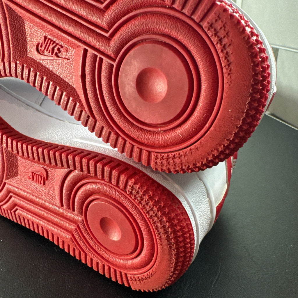 Nike Air Force 1 Low sneakers in White and University Red leather, Youth size 7Y.