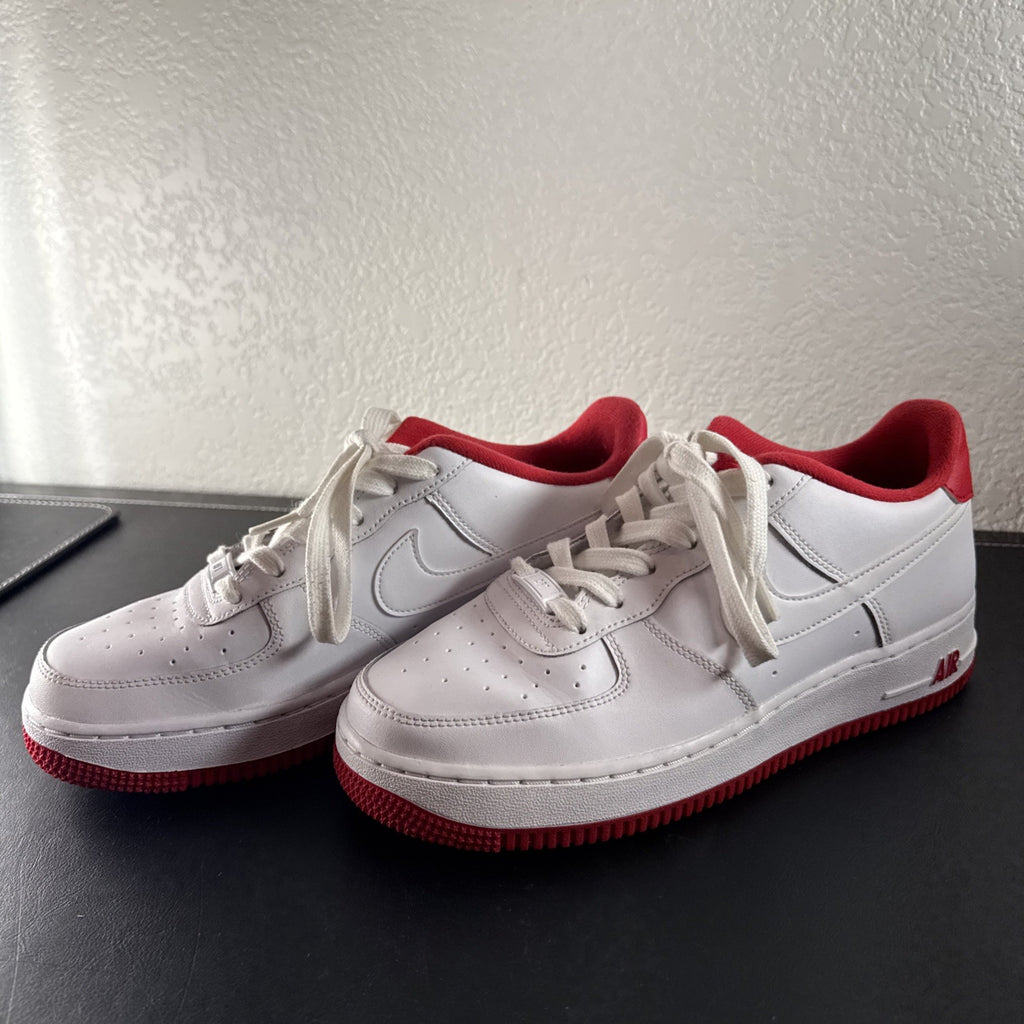 Nike Air Force 1 Low sneakers in White and University Red leather, Youth size 7Y.