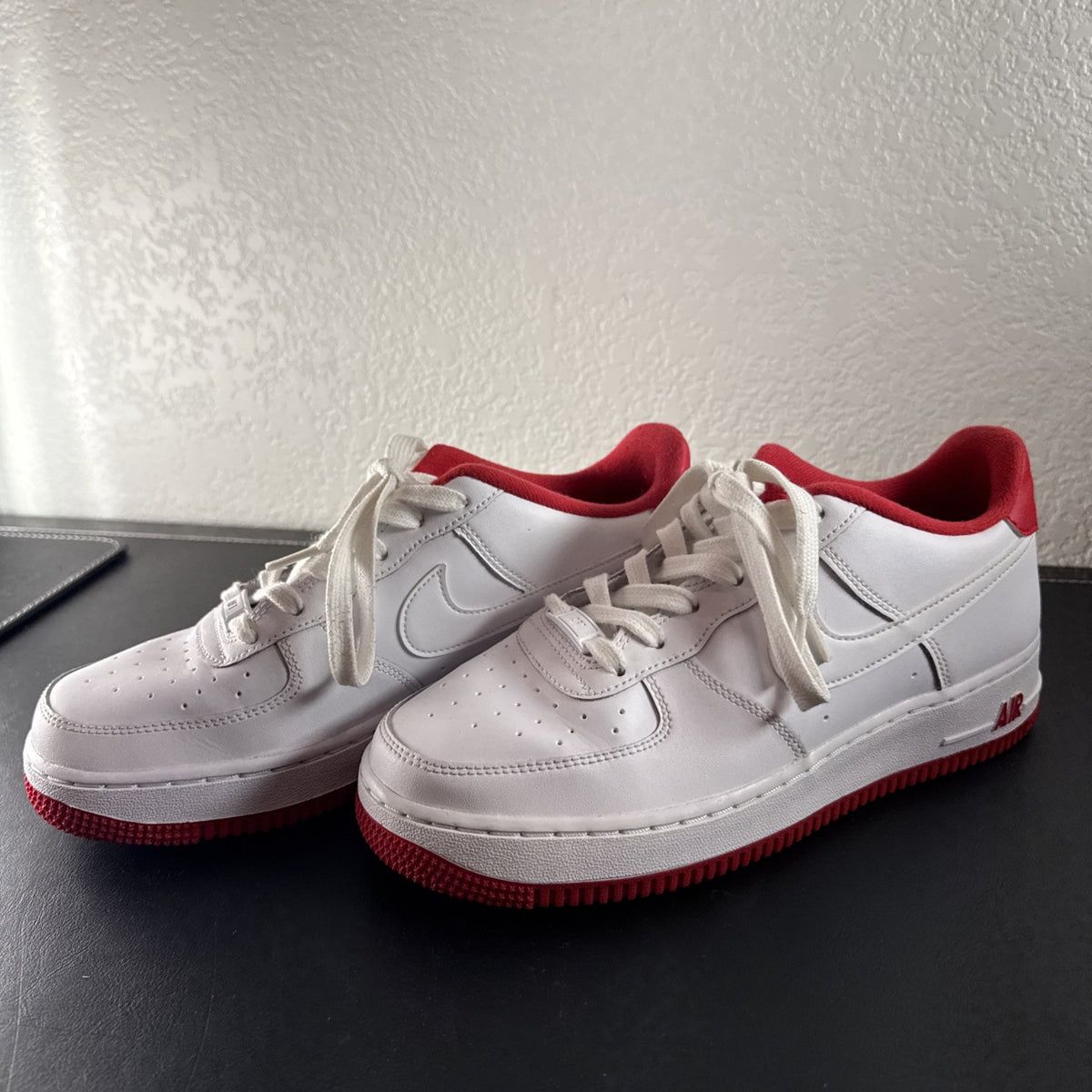 Nike Air Force 1 Low sneakers in White and University Red leather, Youth size 7Y.
