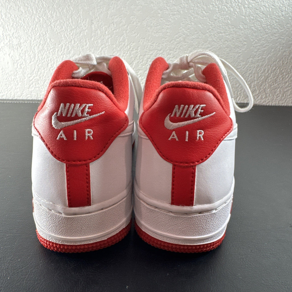 Nike Air Force 1 Low sneakers in White and University Red leather, Youth size 7Y.