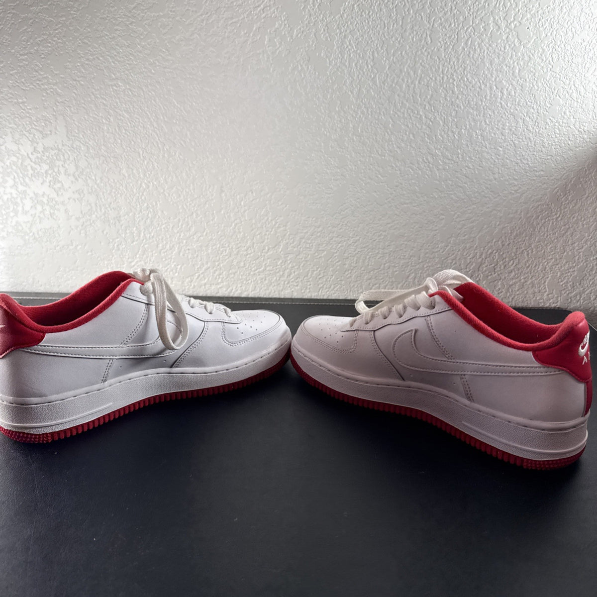 Nike Air Force 1 Low sneakers in White and University Red leather, Youth size 7Y.