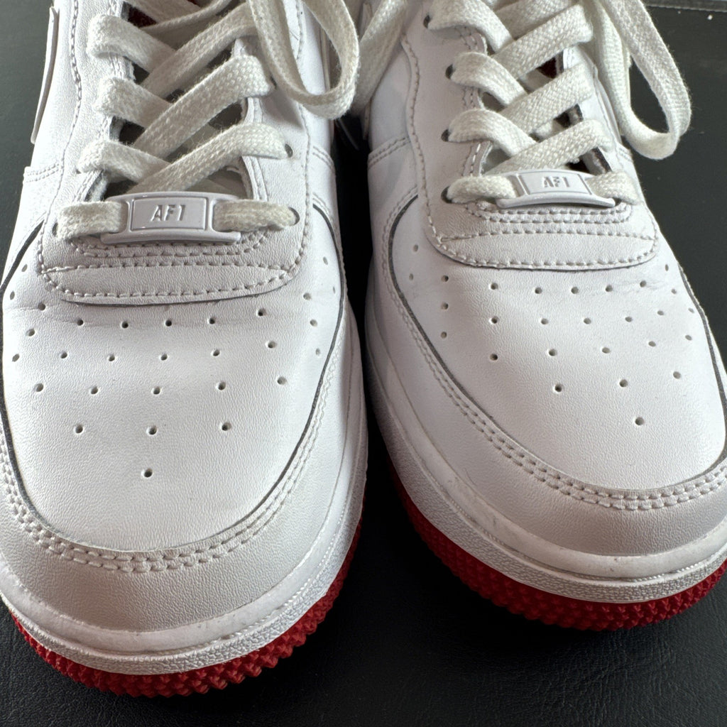 Nike Air Force 1 Low sneakers in White and University Red leather, Youth size 7Y.
