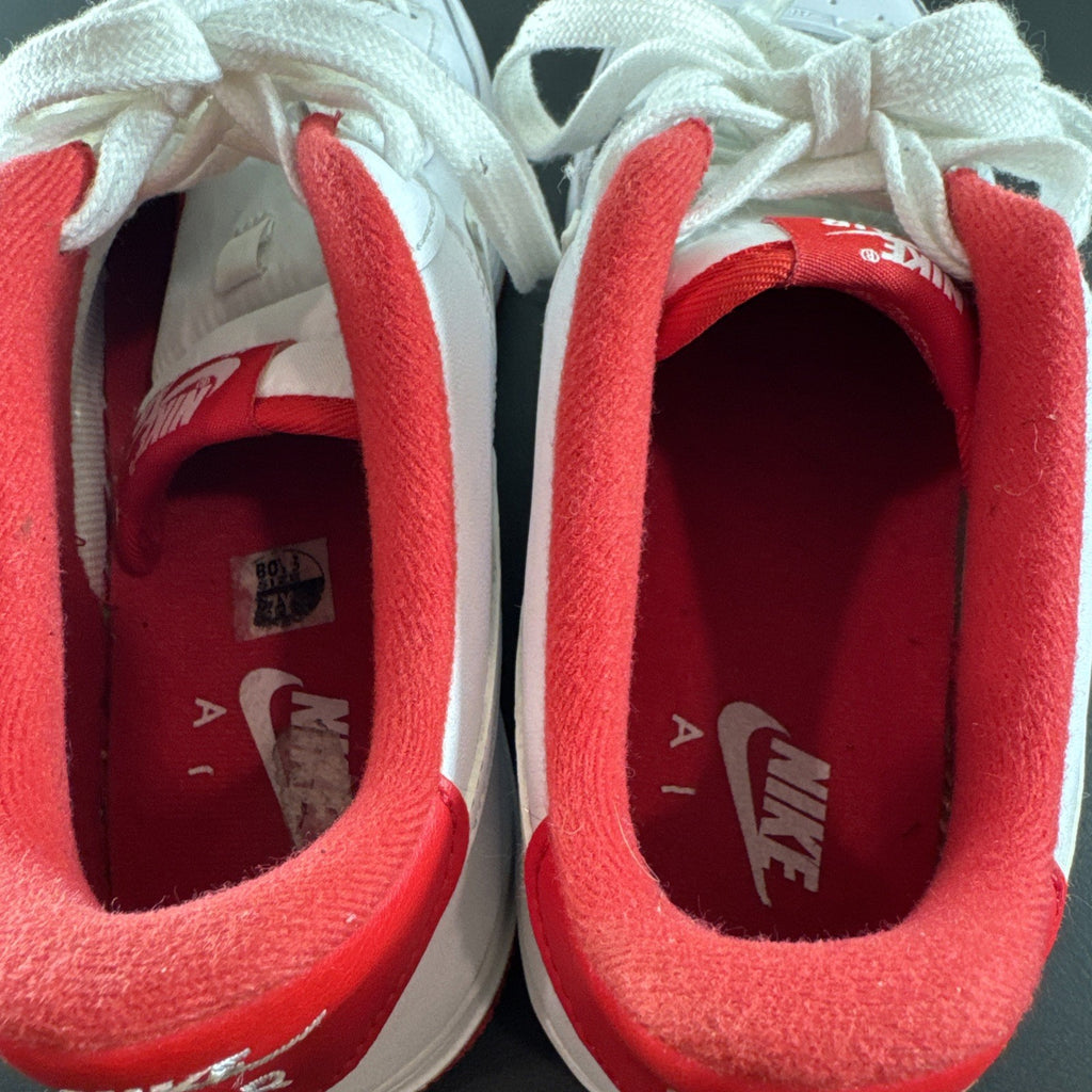 Nike Air Force 1 Low sneakers in White and University Red leather, Youth size 7Y.