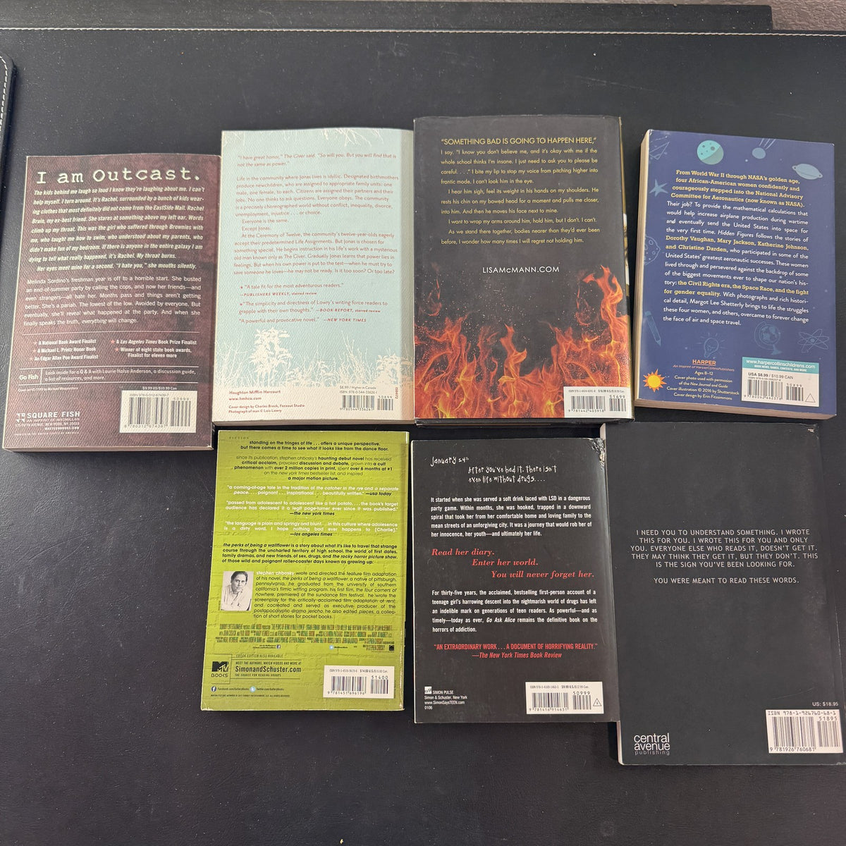 Collection of 7 young adult classic paperback books including The Giver and The Perks of Being a Wallflower