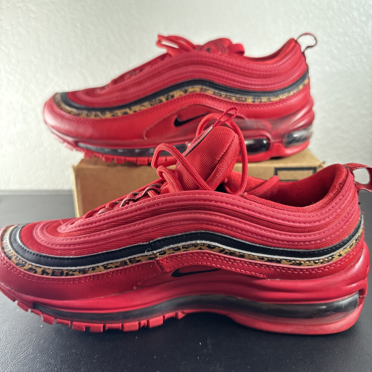 Nike Air Max 97 Leopard Pack red sneakers in women's size 8 showing low-top synthetic upper and outsole detail