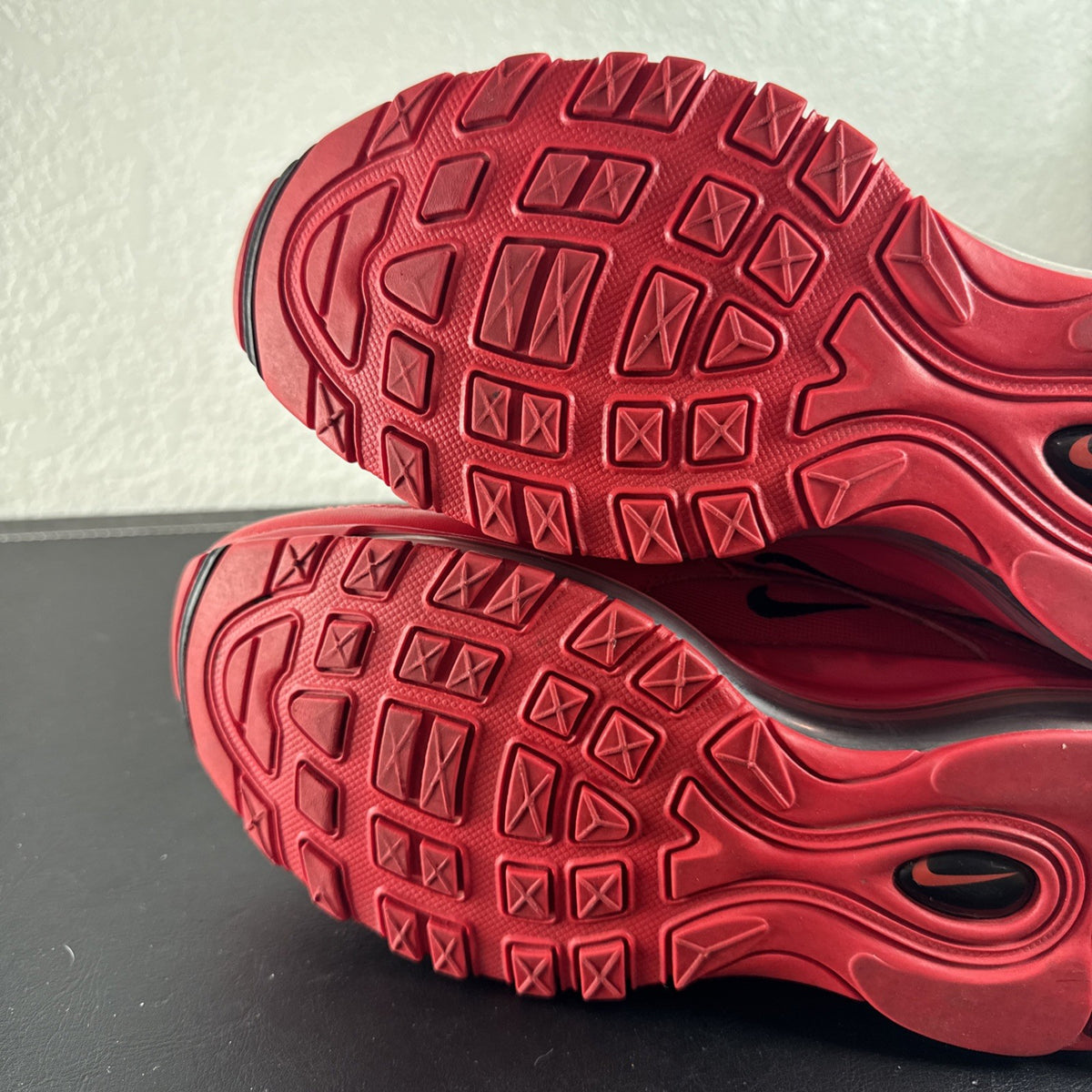 Nike Air Max 97 Leopard Pack red sneakers in women's size 8 showing low-top synthetic upper and outsole detail