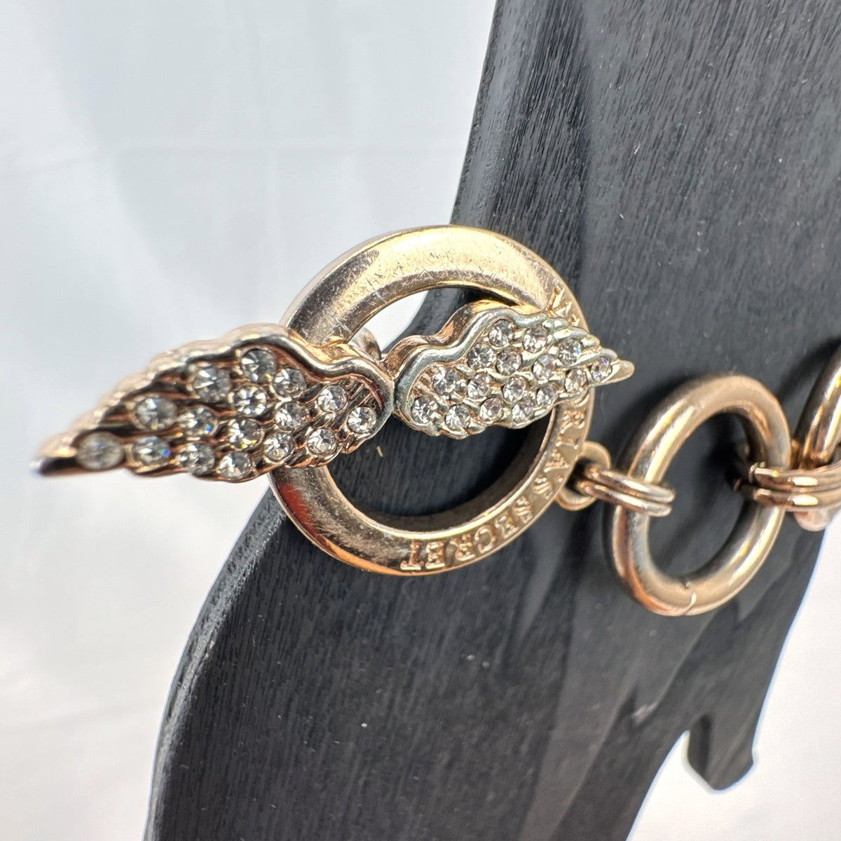 Victoria's Secret rose gold chain bracelet bundle featuring pavé rhinestone angel wings and toggle clasps