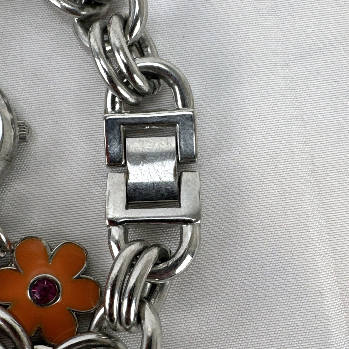 Disney Tinker Bell silver-tone charm bracelet watch with enamel cupcake and flower charms