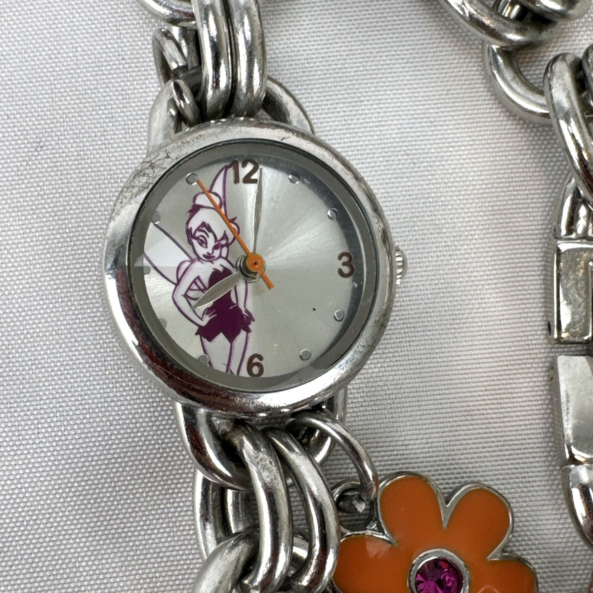 Disney Tinker Bell silver-tone charm bracelet watch with enamel cupcake and flower charms