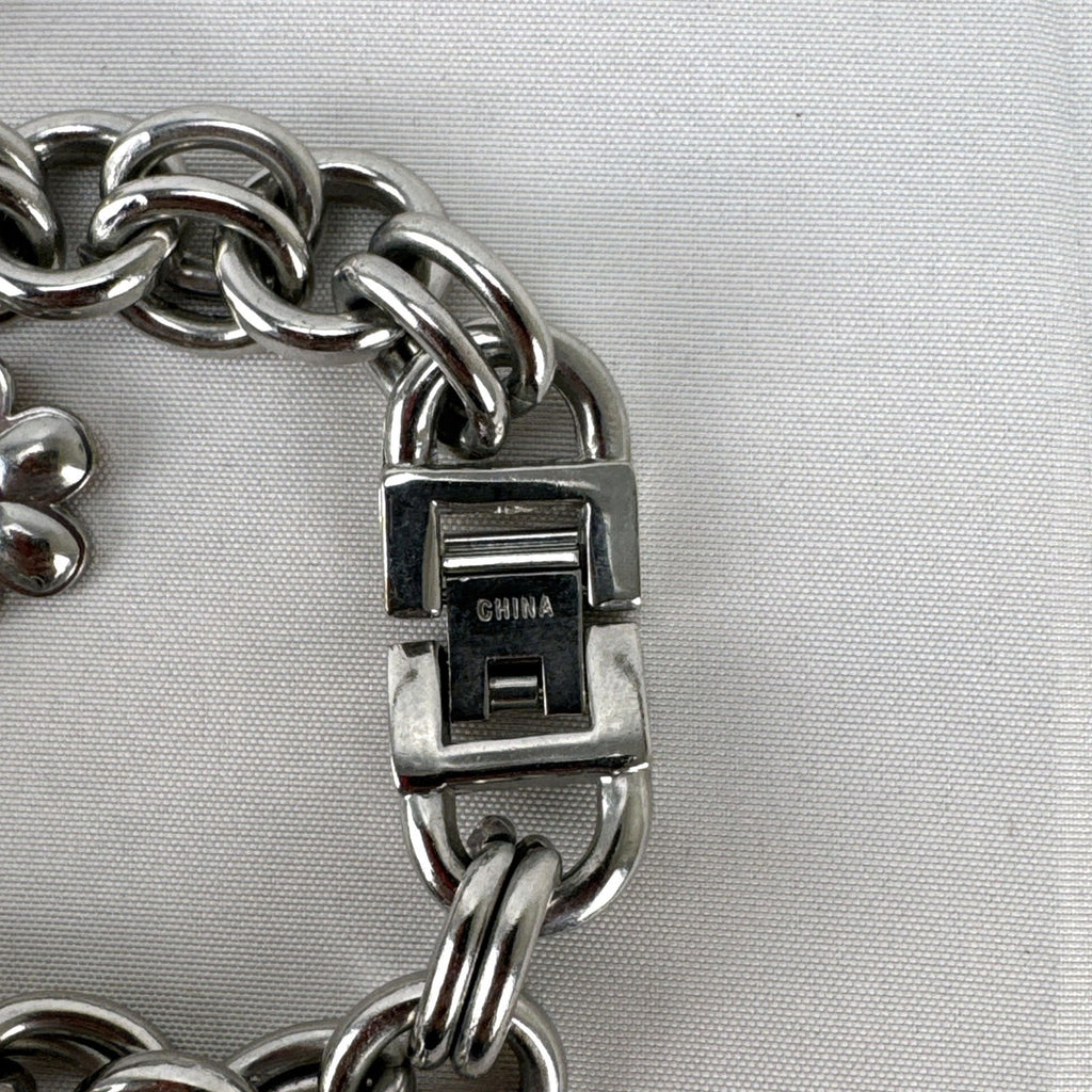 Disney Tinker Bell silver-tone charm bracelet watch with enamel cupcake and flower charms