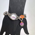 Disney Tinker Bell silver-tone charm bracelet watch with enamel cupcake and flower charms