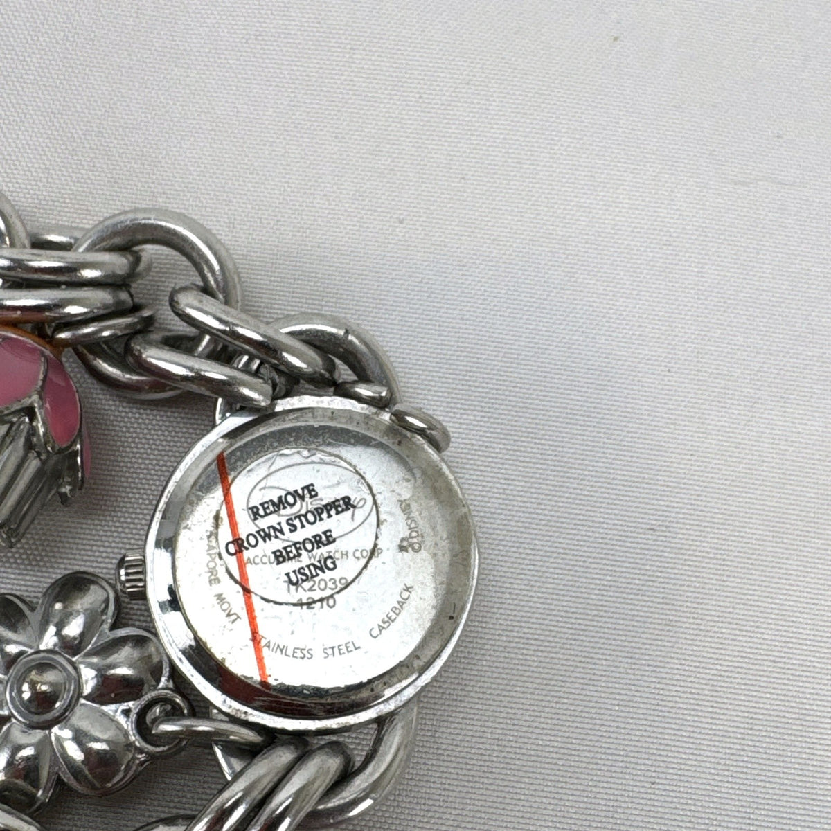 Disney Tinker Bell silver-tone charm bracelet watch with enamel cupcake and flower charms