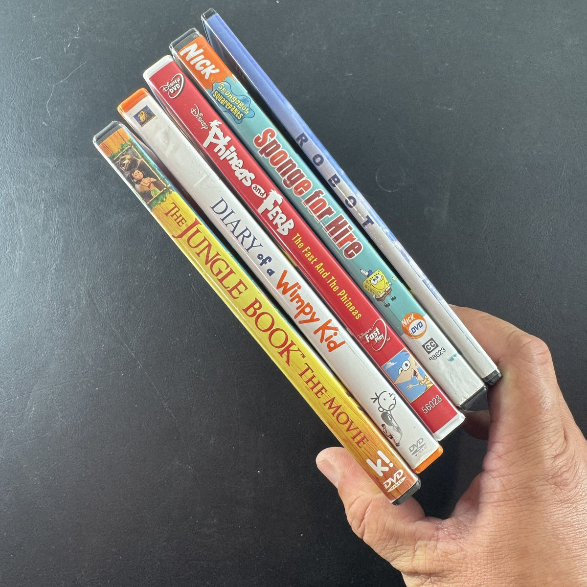 Set of 5 children's family DVDs including Diary of a Wimpy Kid, SpongeBob SquarePants, and Robots.