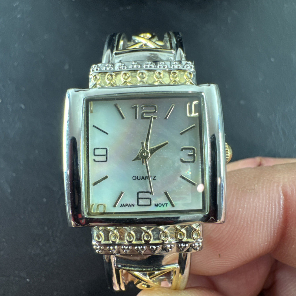 Jaclyn Smith gold tone women's watch and bracelet set featuring a black square case, white dial, and original box.