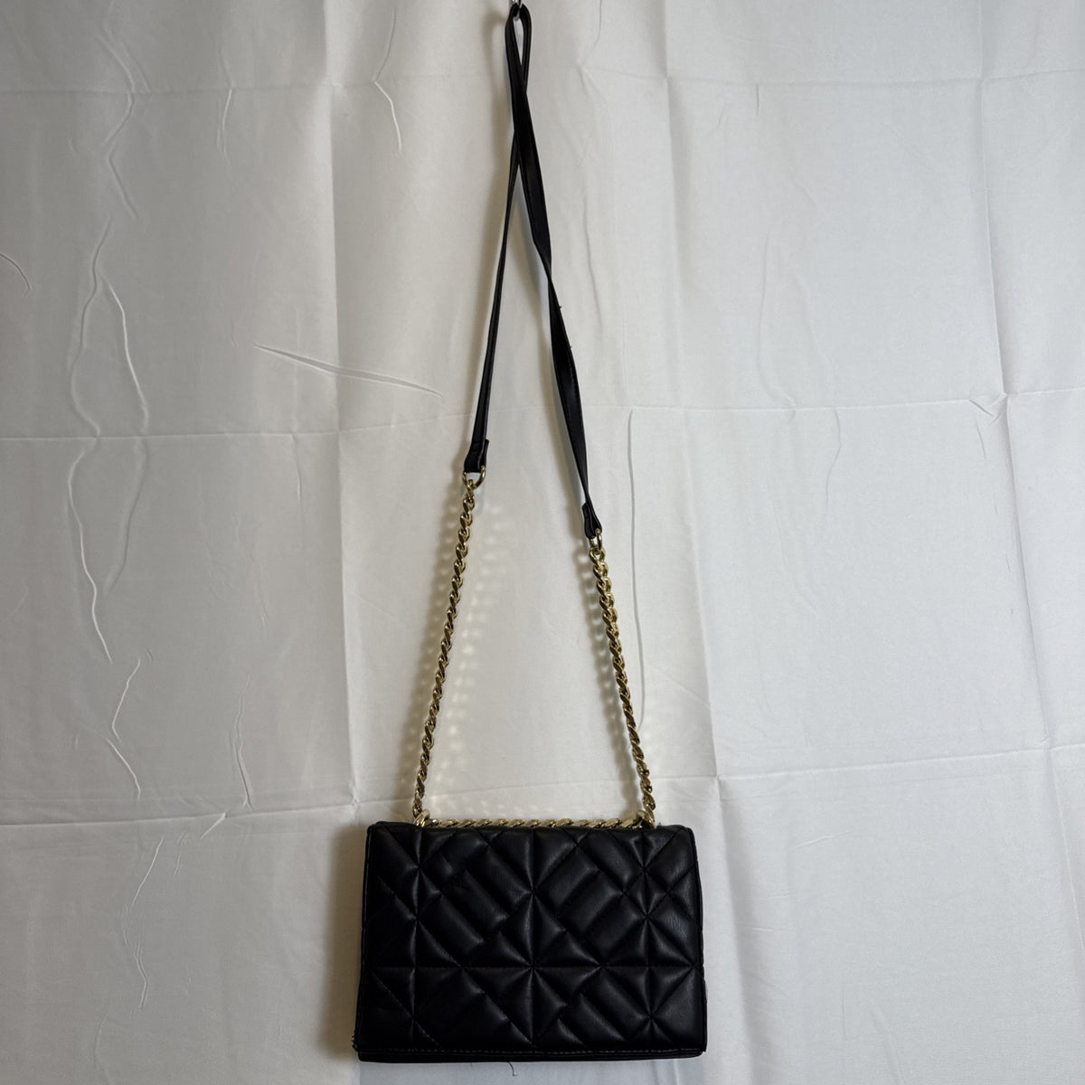 Like Dreams black quilted vegan leather crossbody bag with gold chain accent