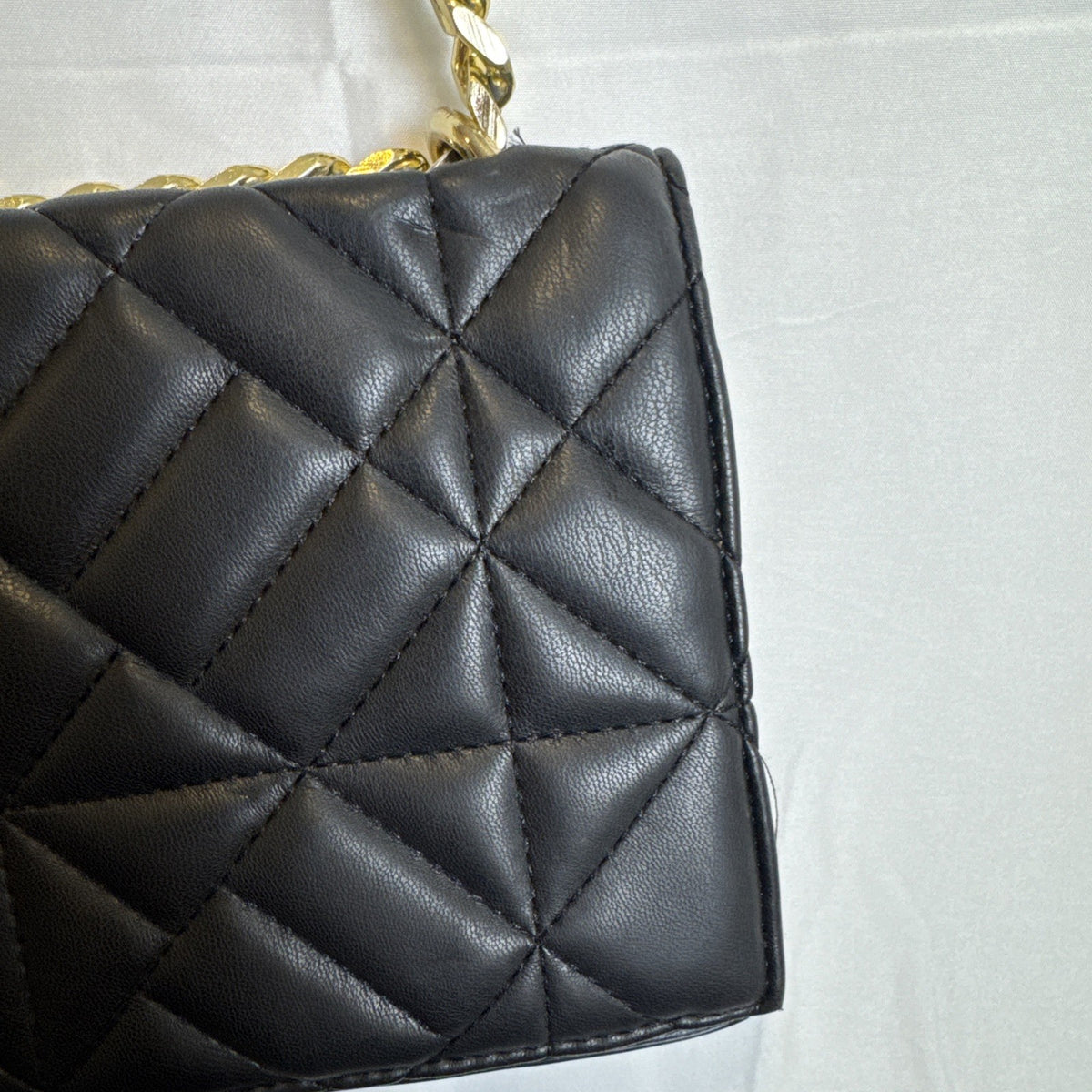Like Dreams black quilted vegan leather crossbody bag with gold chain accent