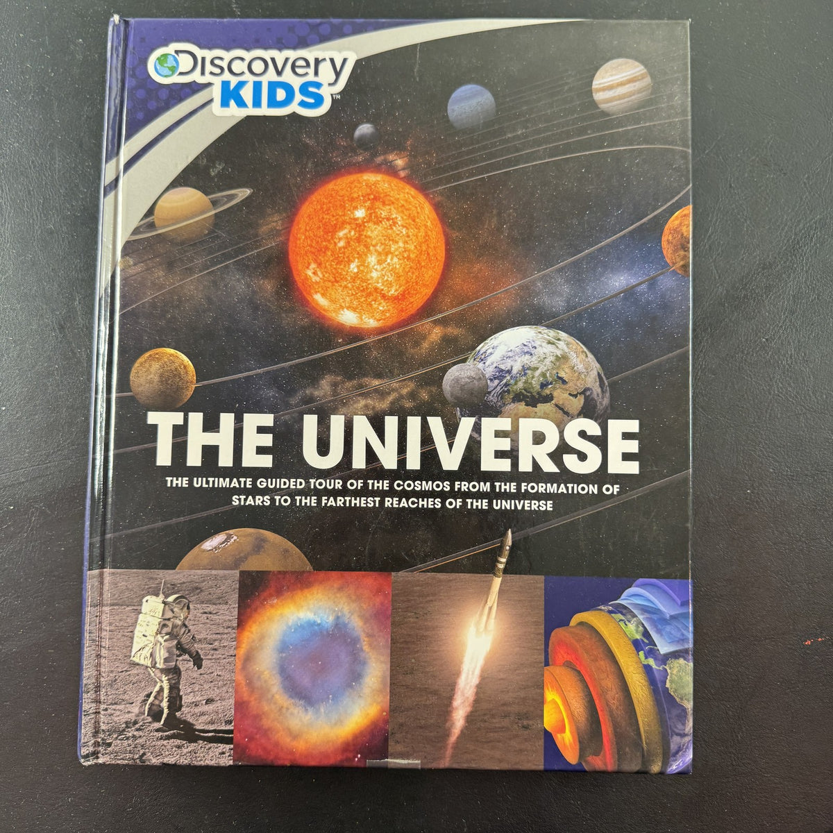 Front cover of Discovery Kids The Universe: The Ultimate Guided Tour of the Cosmos hardcover space science book.