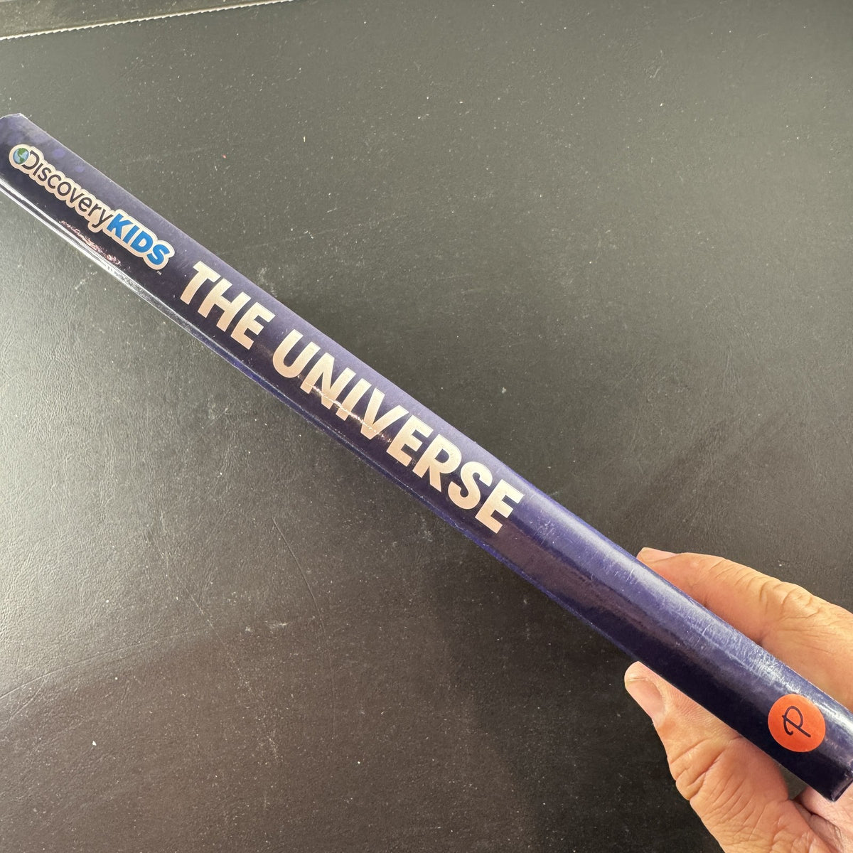 Front cover of Discovery Kids The Universe: The Ultimate Guided Tour of the Cosmos hardcover space science book.