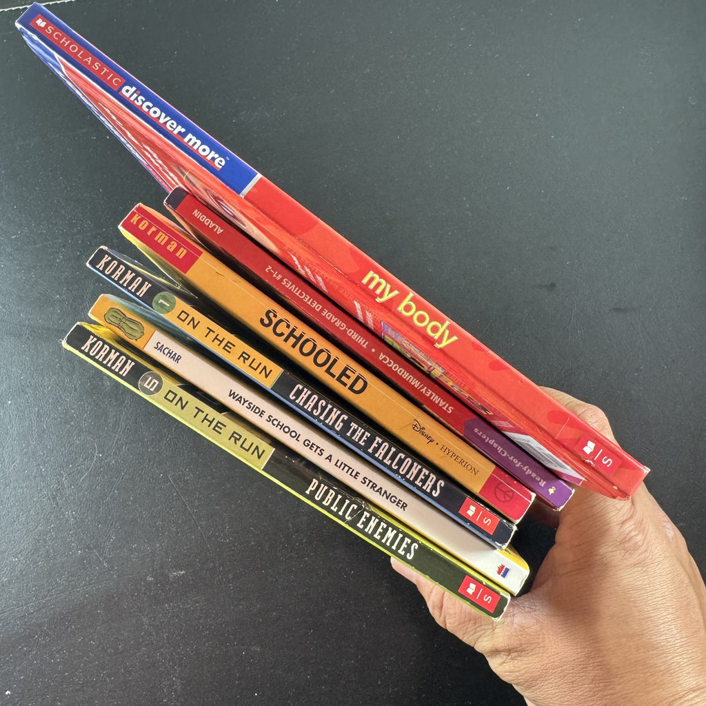 Curated lot of 6 kids adventure and humor books including Gordon Korman and Louis Sachar titles