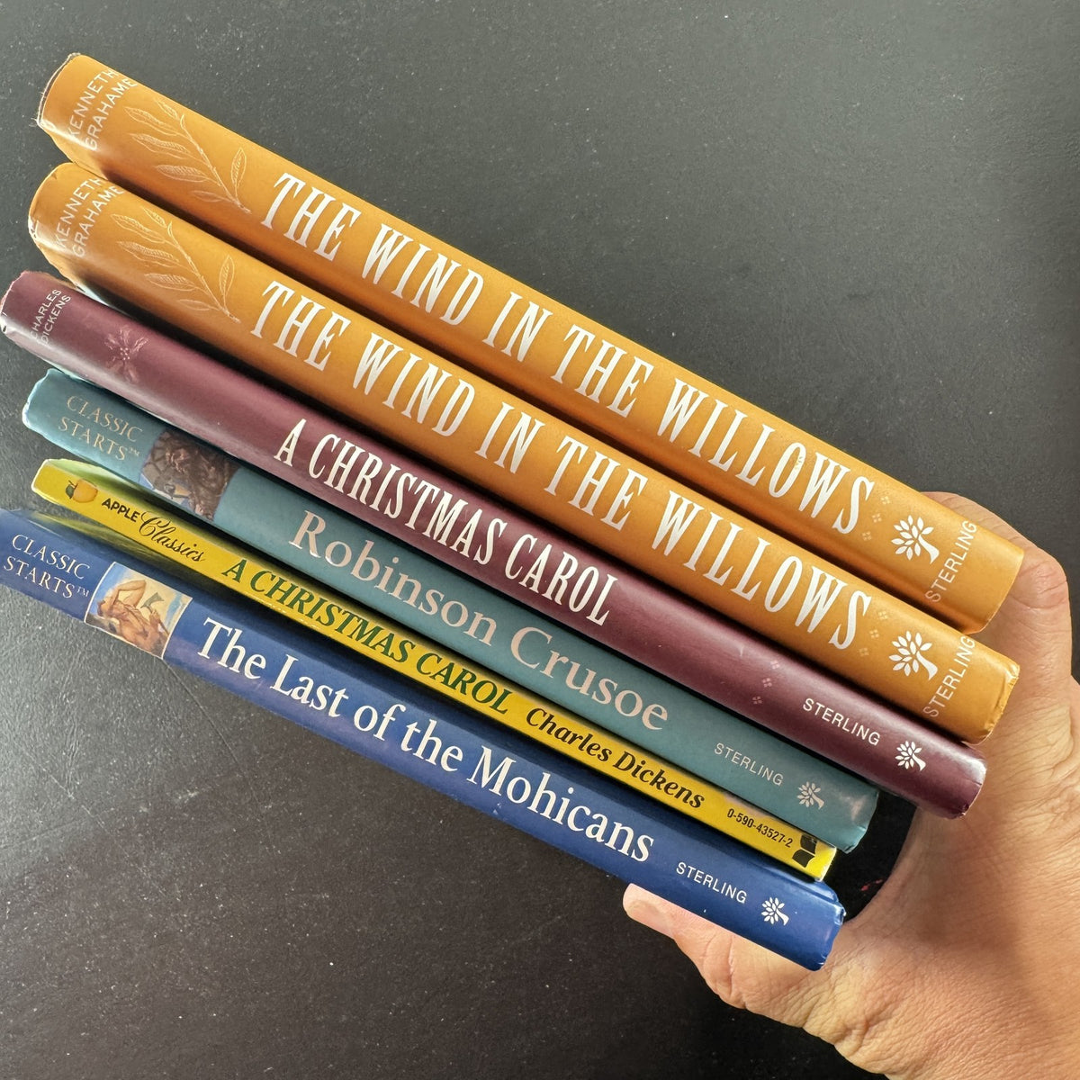 Lot of 6 classic children's hardcover and paperback books including A Christmas Carol and The Wind in the Willows.