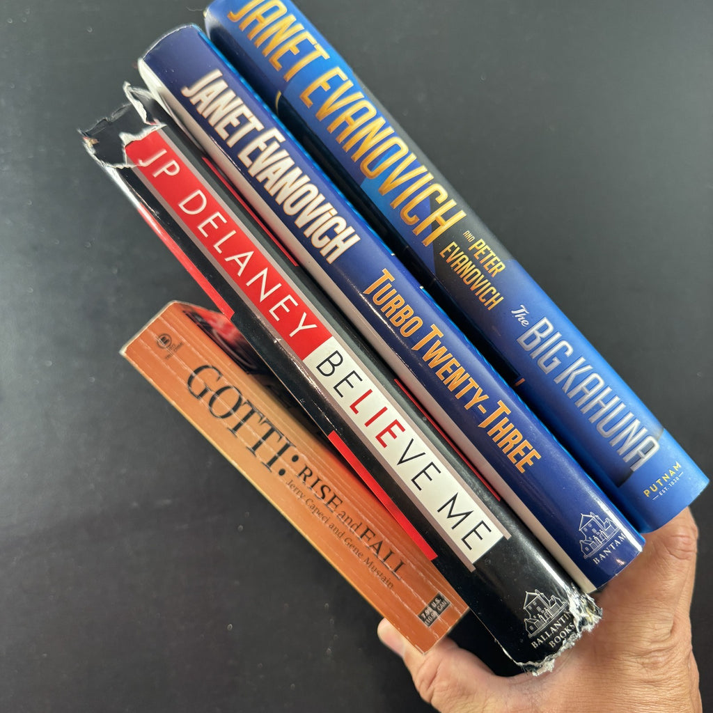 Set of four crime and mystery books featuring Janet Evanovich titles in very good condition.