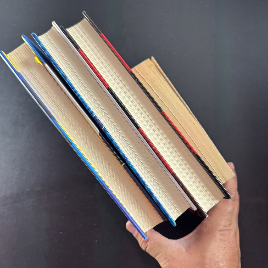 Set of four crime and mystery books featuring Janet Evanovich titles in very good condition.