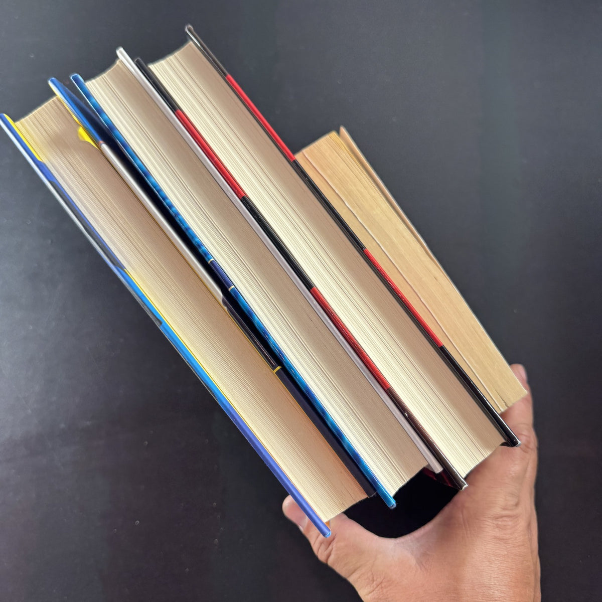 Set of four crime and mystery books featuring Janet Evanovich titles in very good condition.