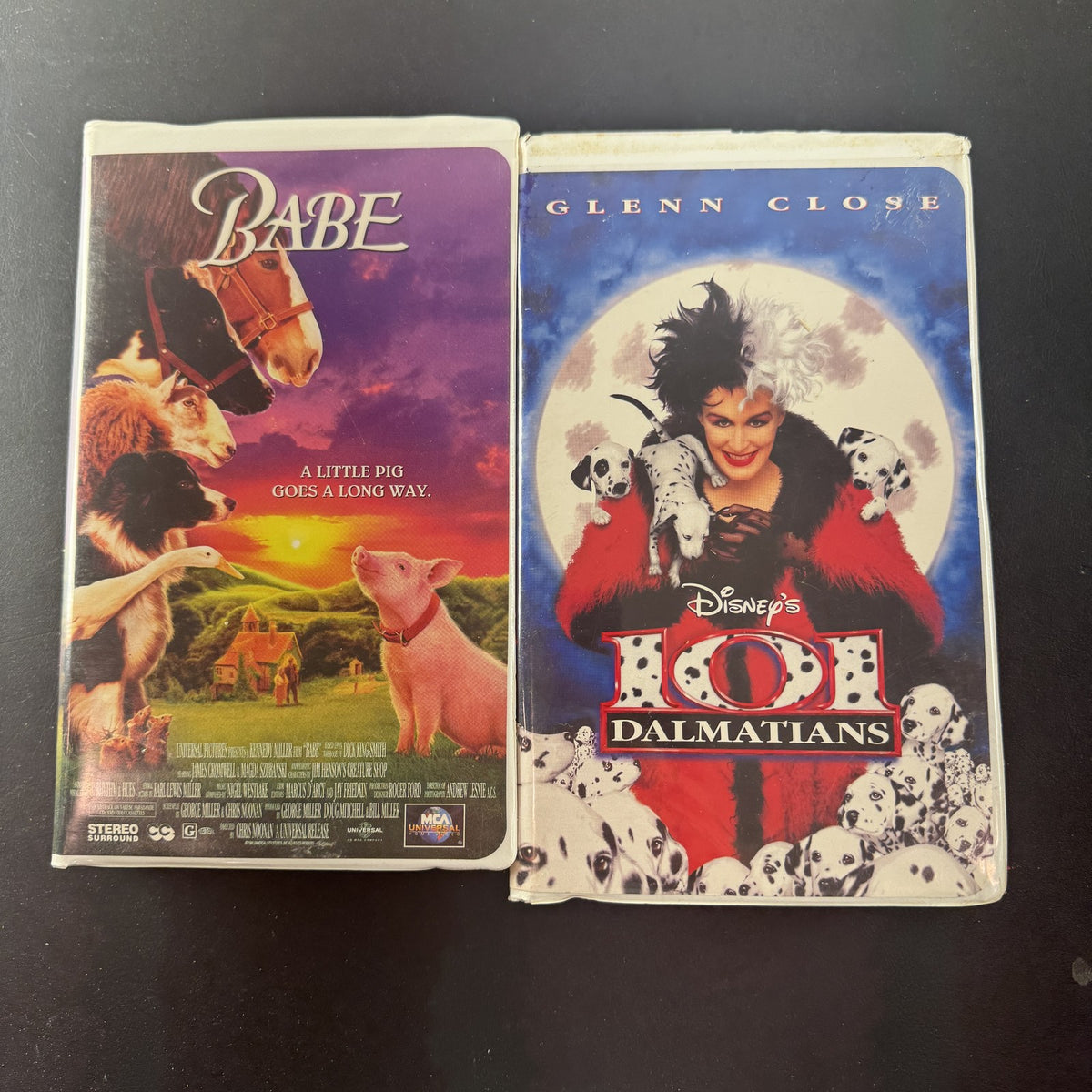 101 Dalmatians and Babe VHS movie tape lot featuring Disney live-action film and MCA Universal release