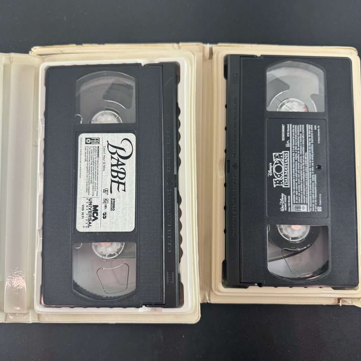 101 Dalmatians and Babe VHS movie tape lot featuring Disney live-action film and MCA Universal release