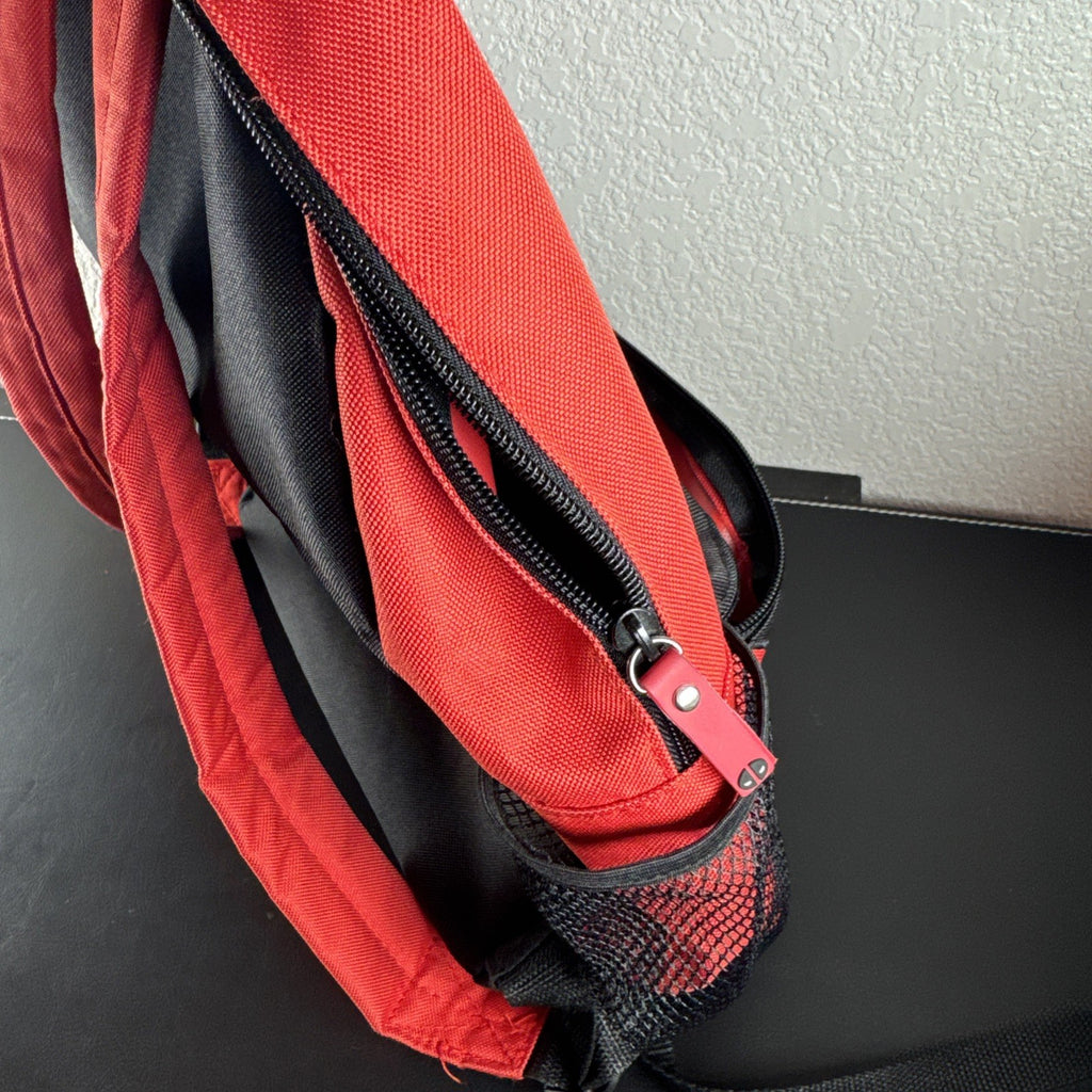 Official Marvel Deadpool red and black character backpack featuring the iconic eye mask design.