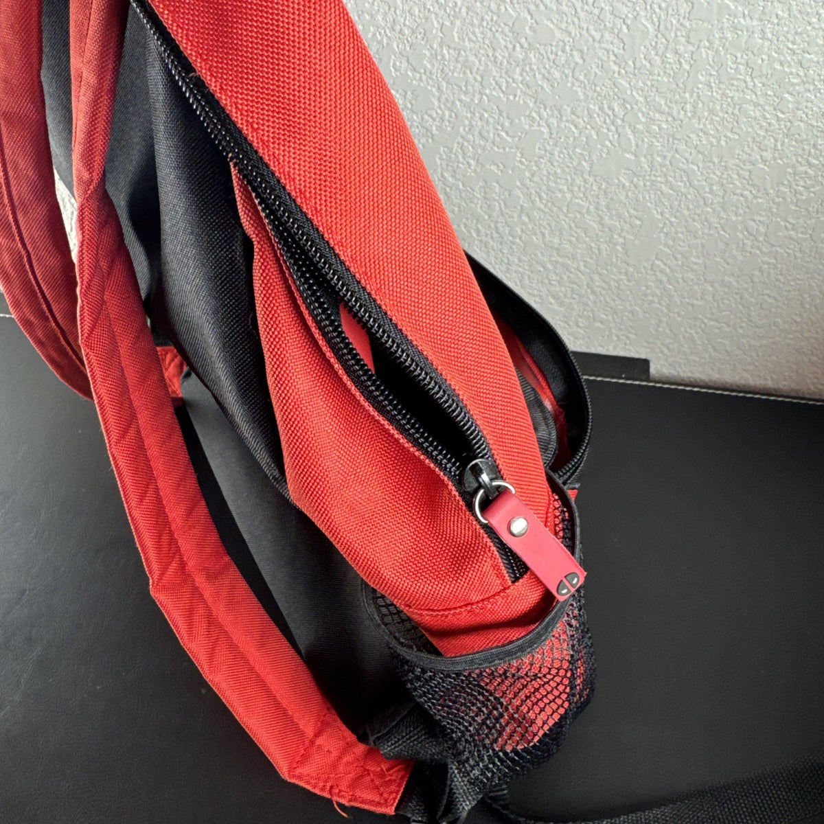 Official Marvel Deadpool red and black character backpack featuring the iconic eye mask design.