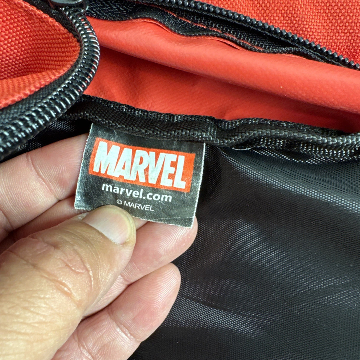 Official Marvel Deadpool red and black character backpack featuring the iconic eye mask design.