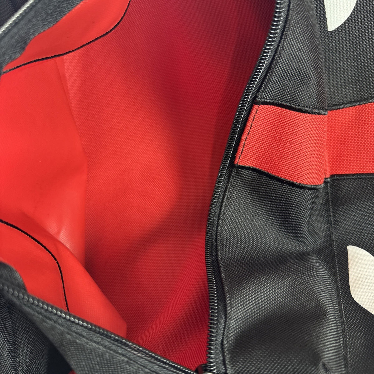Official Marvel Deadpool red and black character backpack featuring the iconic eye mask design.