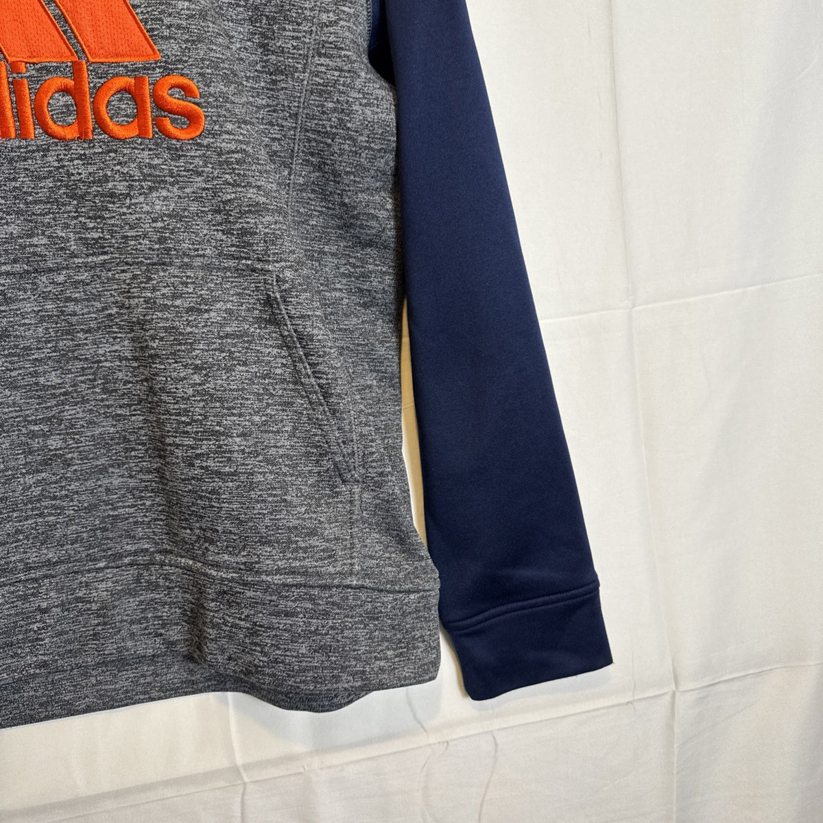 adidas youth size Large gray fleece pullover hoodie with dark blue and orange accents and stitched logo