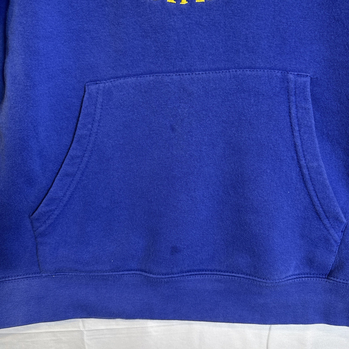 Front view of a pre-owned blue Golden State Warriors NBA pullover hoodie in Boys size XL.