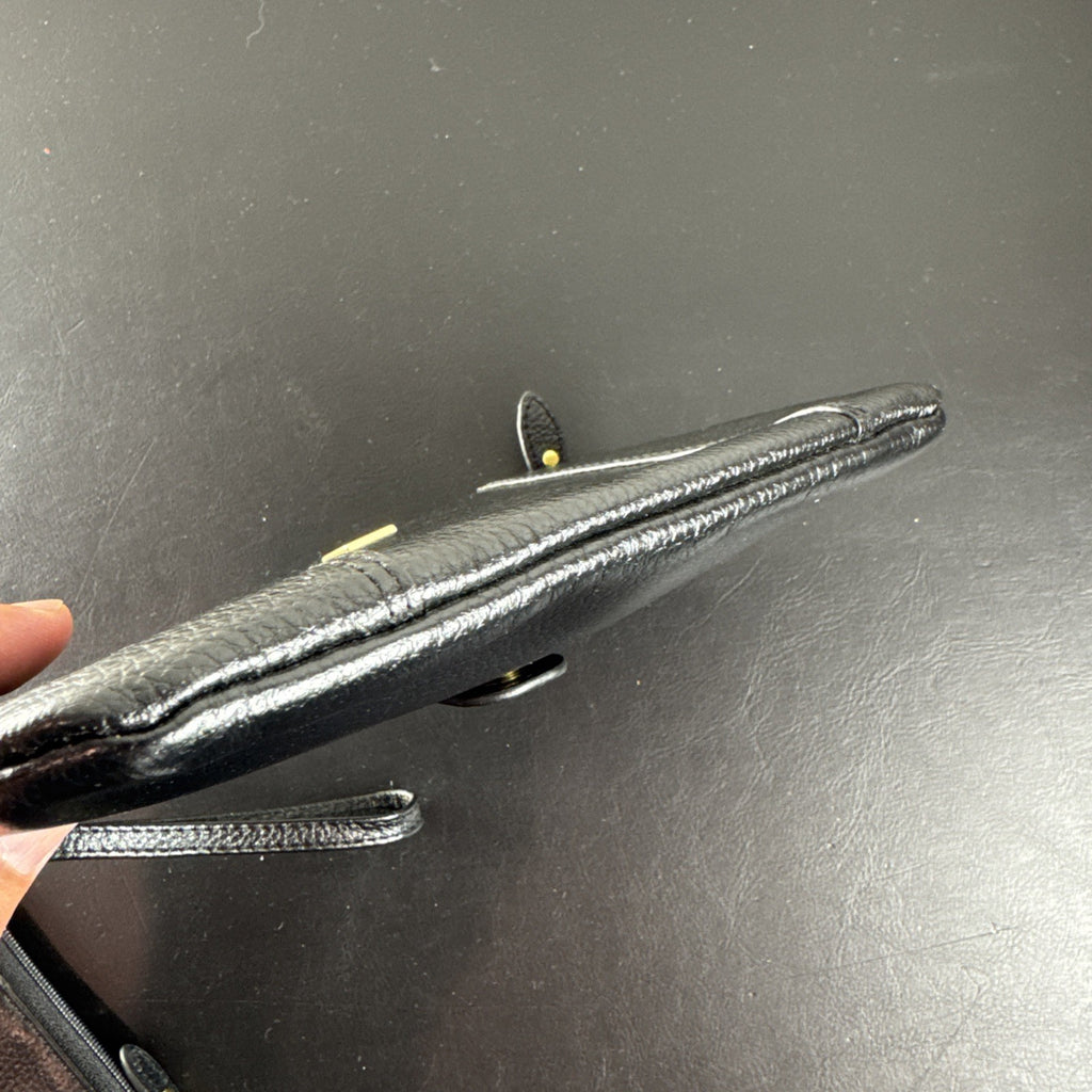 LODIS black pebbled leather wristlet clutch and matching card wallet set with gold-tone hardware.