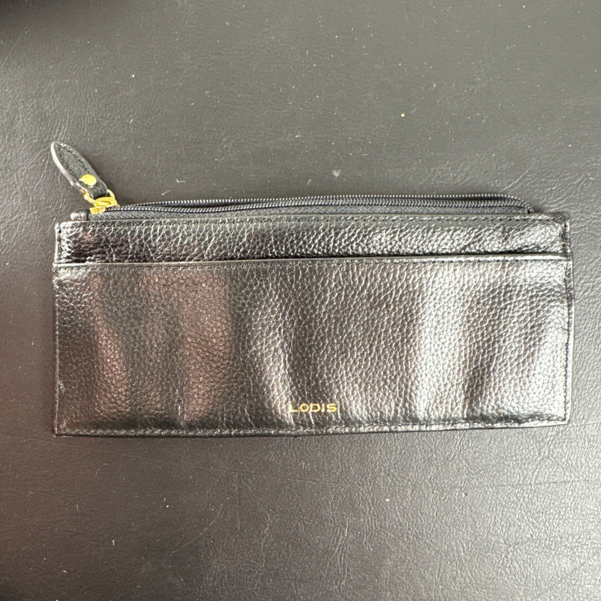 LODIS black pebbled leather wristlet clutch and matching card wallet set with gold-tone hardware.