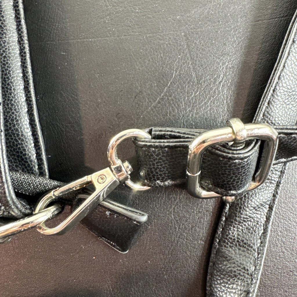 Bella Russo black quilted faux leather crossbody bag with silver-tone heart zipper pull.