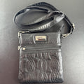 Bella Russo black quilted faux leather crossbody bag with silver-tone heart zipper pull.
