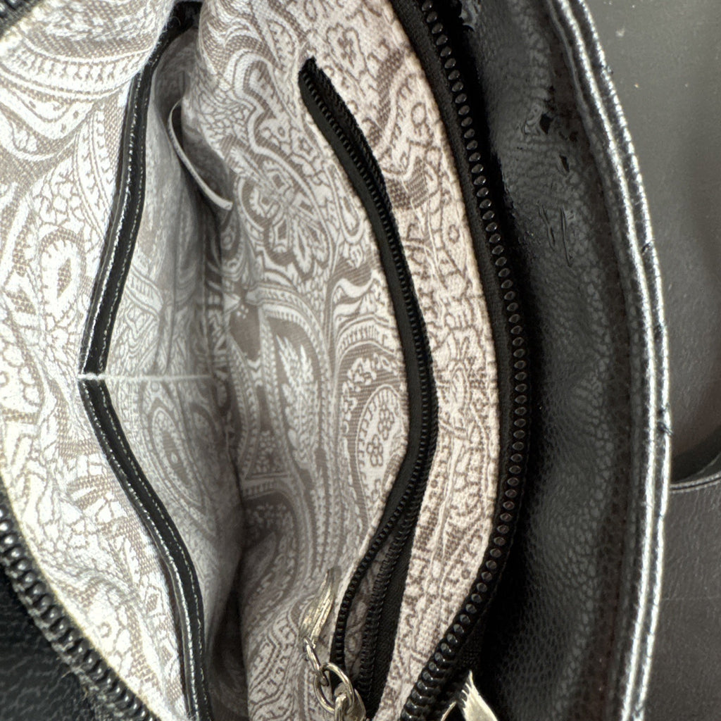 Bella Russo black quilted faux leather crossbody bag with silver-tone heart zipper pull.