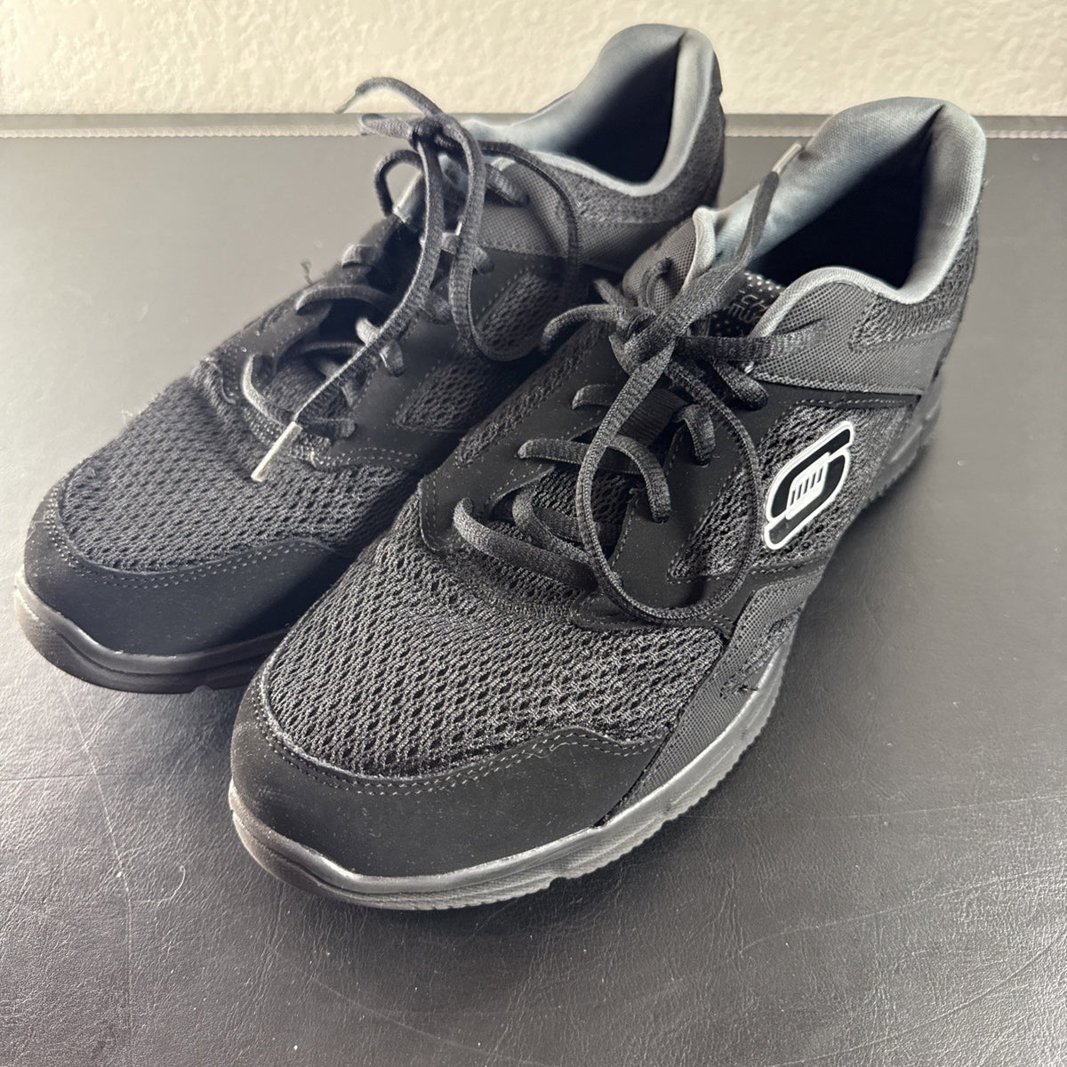 Black Skechers LightWeight low-top sneakers in unisex size 8.5 with memory foam insoles