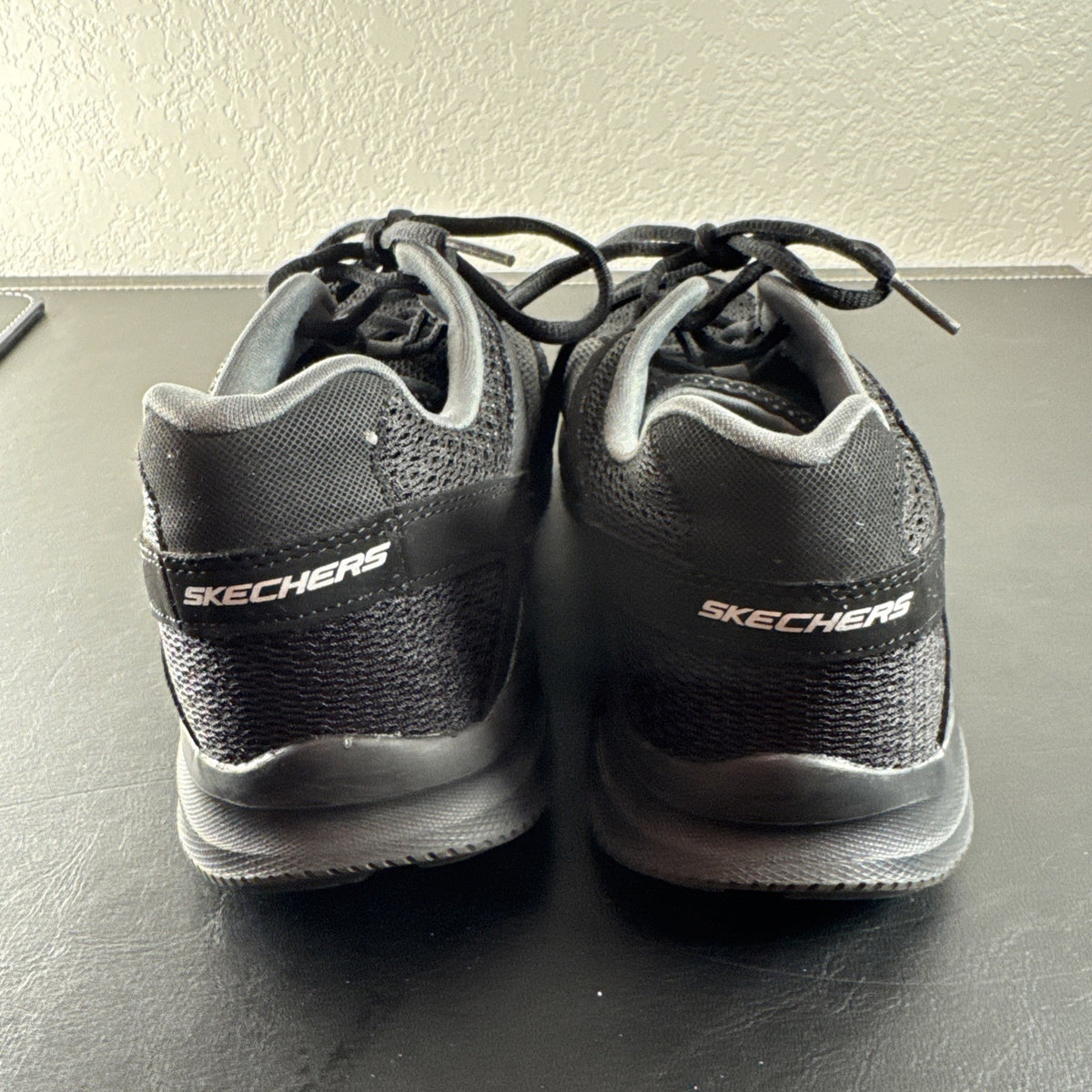 Black Skechers LightWeight low-top sneakers in unisex size 8.5 with memory foam insoles