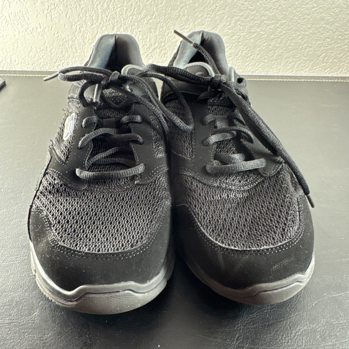 Black Skechers LightWeight low-top sneakers in unisex size 8.5 with memory foam insoles
